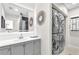 The bathroom features modern fixtures and a stacked washer and dryer at 7530 85Th Ln, Seminole, FL 33777