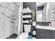 Modern bathroom with marble walls, a stylish vanity, and ample storage space for a clean and sleek look at 7530 85Th Ln, Seminole, FL 33777