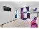 Stylish bedroom with a full-size bed, bunk bed, and a TV wall mount at 7530 85Th Ln, Seminole, FL 33777
