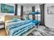 Bright bedroom with bunk beds, large bed, and windows with shades for ample natural light at 7530 85Th Ln, Seminole, FL 33777