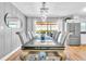 The dining room features a stylish chandelier and a large window that brings the outside in at 7530 85Th Ln, Seminole, FL 33777