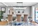 Elegant dining area features a modern chandelier and dining set with seating for six, perfect for gatherings at 7530 85Th Ln, Seminole, FL 33777