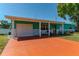 Charming single-story home featuring a vibrant exterior, attached garage, and well-maintained landscaping at 7530 85Th Ln, Seminole, FL 33777