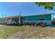 Inviting home with vibrant landscaping and a well-kept lawn creating an appealing curb appeal at 7530 85Th Ln, Seminole, FL 33777