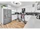 Modern kitchen with stainless steel appliances, white cabinets, and stylish countertops for a sleek design at 7530 85Th Ln, Seminole, FL 33777