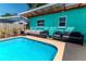 Inviting pool area with comfortable seating is ideal for outdoor relaxation and entertainment at 7530 85Th Ln, Seminole, FL 33777