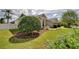 Charming single-story home with well-manicured landscaping and an inviting entrance at 7824 Primula Ln, New Port Richey, FL 34654