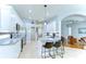 Modern kitchen with granite countertops, stainless steel appliances, and a breakfast bar at 7824 Primula Ln, New Port Richey, FL 34654