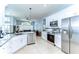 Well-appointed kitchen with stainless steel appliances, granite countertops, and ample cabinet space at 7824 Primula Ln, New Port Richey, FL 34654