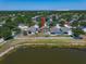 Aerial view of a home featuring a fenced backyard with lake and neighborhood at 8103 Tar Hollow Dr, Gibsonton, FL 33534