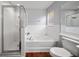 Cozy bathroom featuring glass shower, soaking tub, and neutral finishes offers relaxation at 8103 Tar Hollow Dr, Gibsonton, FL 33534