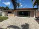 Spacious backyard with a brick patio, offering plenty of space for outdoor entertaining at 833 Lantana Ave, Clearwater Beach, FL 33767