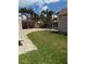 Lush backyard with a well-maintained lawn, perfect for gardening and outdoor recreation at 833 Lantana Ave, Clearwater Beach, FL 33767