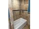 This bathtub area features tile walls, a recessed niche, and is currently under construction at 833 Lantana Ave, Clearwater Beach, FL 33767