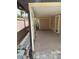 Covered outdoor patio with a concrete floor, double doors, and access to the backyard at 833 Lantana Ave, Clearwater Beach, FL 33767