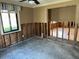 This room features a window with a curtain and visible wood framing, indicating ongoing renovations at 833 Lantana Ave, Clearwater Beach, FL 33767