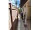 The property features a narrow walkway alongside the house, secured by a wooden fence at 833 Lantana Ave, Clearwater Beach, FL 33767