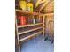 Organized storage shed interior with shelves, perfect for keeping your tools and equipment tidy at 833 Lantana Ave, Clearwater Beach, FL 33767