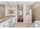 Lavish bathroom featuring double sinks, tile flooring, a shower, and a garden tub at 8463 Dunham Station Dr, Tampa, FL 33647