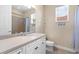 Bathroom featuring white cabinets, neutral colors and a shower with curtain at 8463 Dunham Station Dr, Tampa, FL 33647