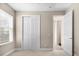 A bedroom featuring closet and neutral carpet at 8463 Dunham Station Dr, Tampa, FL 33647