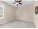Bedroom featuring neutral walls, ceiling fan and carpet at 8463 Dunham Station Dr, Tampa, FL 33647