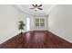 Bedroom features hardwood floors and a neutral paint color at 8463 Dunham Station Dr, Tampa, FL 33647