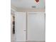 A closet featuring white doors and an open doorway reveals the home's interior at 8463 Dunham Station Dr, Tampa, FL 33647