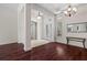 Spacious foyer featuring dark wood floors, high ceilings, and decorative lighting at 8463 Dunham Station Dr, Tampa, FL 33647