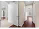Hallway features hardwood floors and access to other rooms at 8463 Dunham Station Dr, Tampa, FL 33647