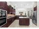 Expansive kitchen featuring granite countertops, stainless steel appliances, and open floorplan at 8463 Dunham Station Dr, Tampa, FL 33647
