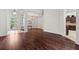 Open-concept living area with hardwood floors and abundant natural light at 8463 Dunham Station Dr, Tampa, FL 33647