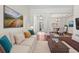 Bright living room with a comfortable sofa and view into a dining area at 8463 Dunham Station Dr, Tampa, FL 33647