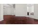 Spacious living room with hardwood floors and neutral wall colors at 8463 Dunham Station Dr, Tampa, FL 33647