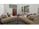 Comfortable living room with plush couches and sliding glass doors to the outdoor patio at 8463 Dunham Station Dr, Tampa, FL 33647