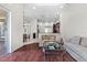 Open-concept living room that flows into the kitchen and dining area for easy entertaining at 8463 Dunham Station Dr, Tampa, FL 33647