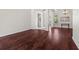 Bright living room featuring hardwood floors and large windows at 8463 Dunham Station Dr, Tampa, FL 33647