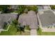 Overhead view of the single-Gathering home with a well maintained roof and lawn at 9327 Pontiac Dr, Tampa, FL 33626