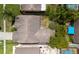 Aerial view showcasing the house and the backyard's potential for outdoor activities at 9327 Pontiac Dr, Tampa, FL 33626
