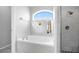 Bathroom with a separate walk-in shower and large soaking tub at 9327 Pontiac Dr, Tampa, FL 33626