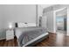 Bedroom features hard wood floors and a large bed at 9327 Pontiac Dr, Tampa, FL 33626