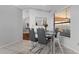 Bright dining area features modern table, chairs, and large window overlooking backyard at 9327 Pontiac Dr, Tampa, FL 33626