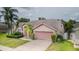 Beautiful single-story house with a two-car garage and well-maintained lawn at 9327 Pontiac Dr, Tampa, FL 33626
