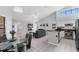 Open concept living room featuring neutral tones, and an adjacent dining area with views to a screened patio at 9327 Pontiac Dr, Tampa, FL 33626