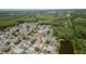 Aerial view of the community location near a pond and wooded areas at 9327 Pontiac Dr, Tampa, FL 33626