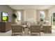 Comfortable living room with neutral tones, plush seating, and a view of the outdoors at 9356 Bonita Mar Dr, Parrish, FL 34219