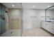 Modern bathroom with a glass shower, updated vanity and fixtures at 962 Marco Ne Dr, St Petersburg, FL 33702