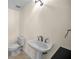 Half bathroom with a pedestal sink and toilet at 962 Marco Ne Dr, St Petersburg, FL 33702