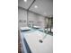 Close-up on bathroom double vanity featuring vessel sinks and modern faucets at 962 Marco Ne Dr, St Petersburg, FL 33702
