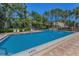 Enjoy a refreshing swim in the community pool surrounded by tropical landscaping and ample lounging space at 962 Marco Ne Dr, St Petersburg, FL 33702